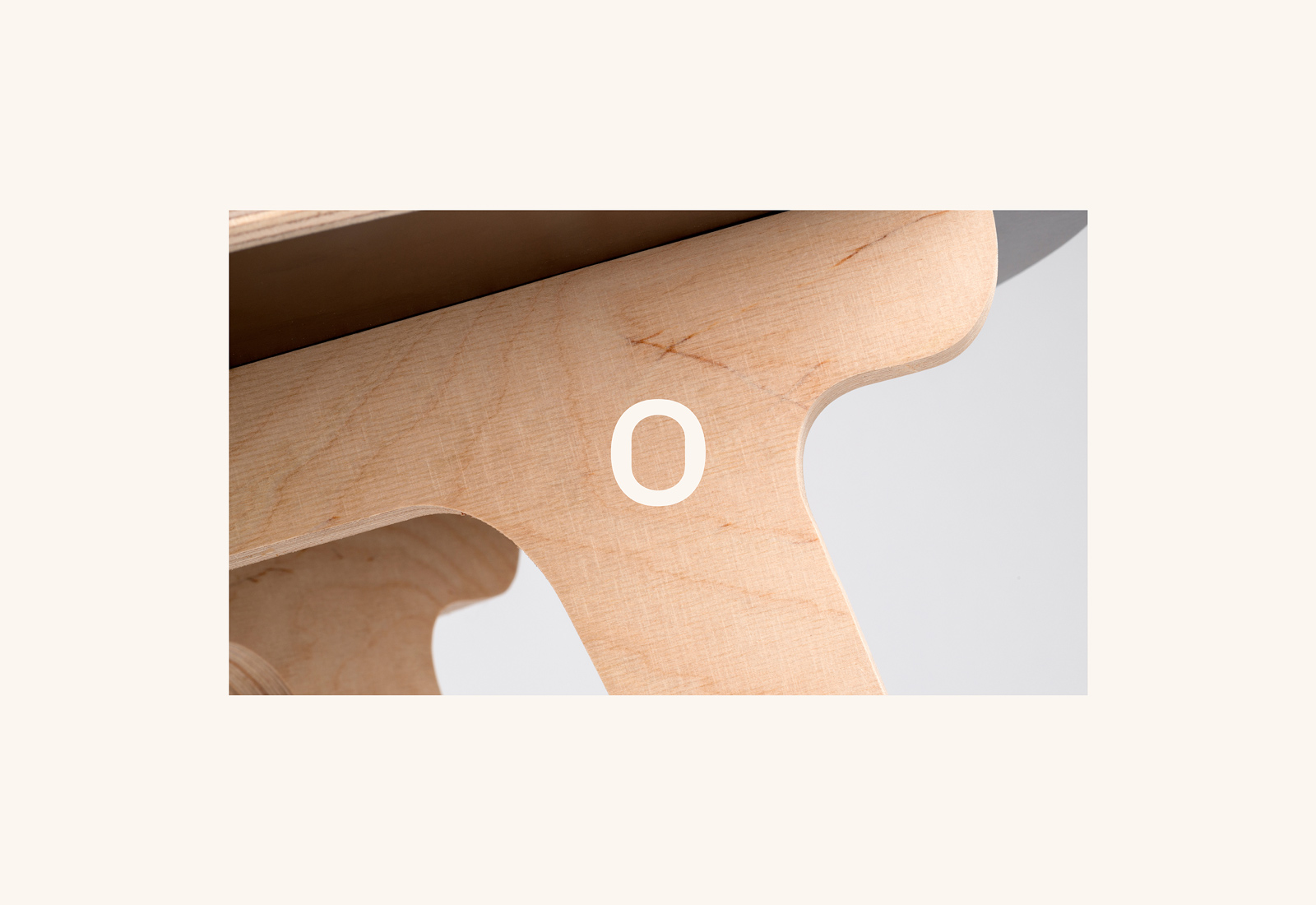 Onemade custom branded Icon sits on top of a wooden leg