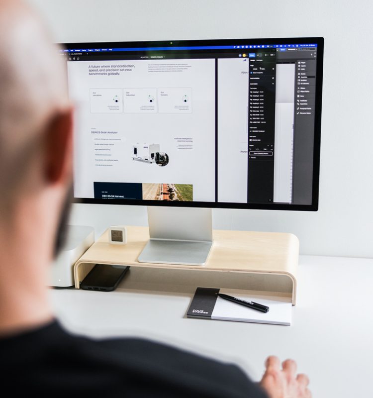 A member of Four Stripes Design Agency in Subiaco skillfully edits a webpage layout, reflecting the precision and attention to detail the agency invests in crafting advanced website interfaces for clients globally.